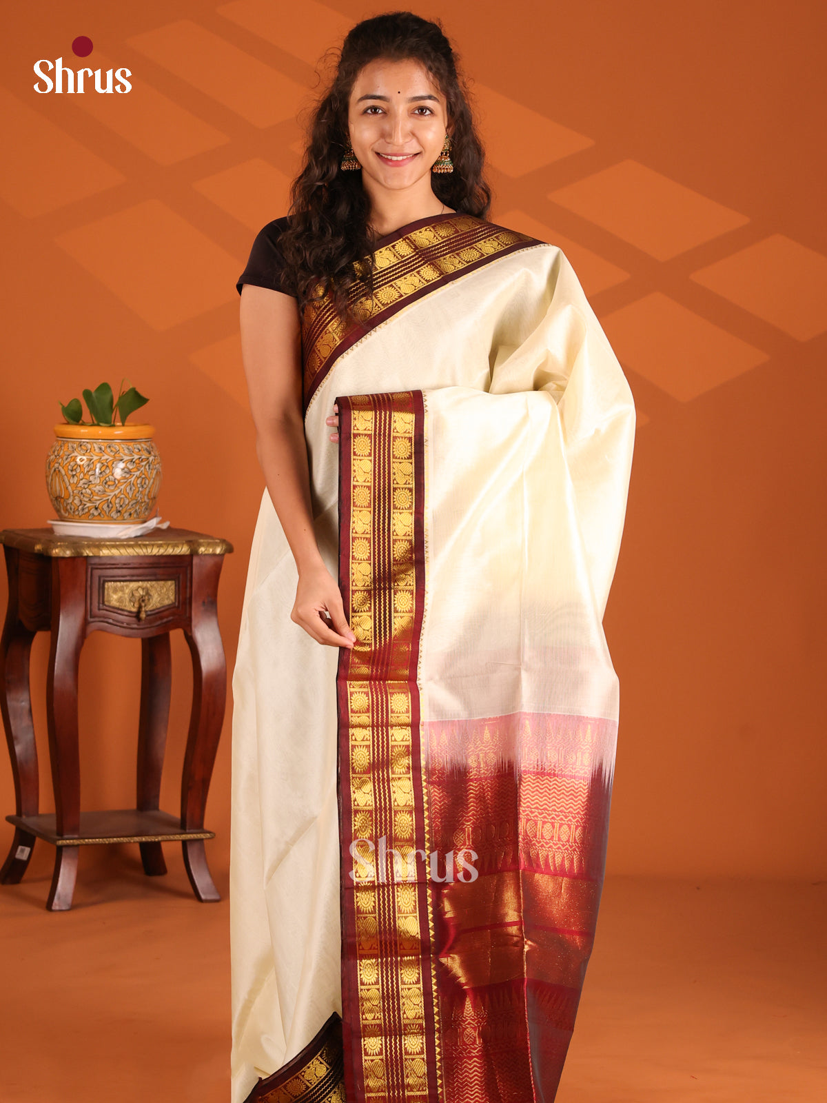 Charming Cream Silk Cotton Saree with brown peacock ,floral zari buttas border - Shop on Shrus.com