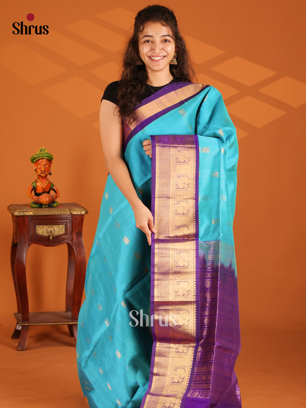 Sky Blue korvai Silk Cotton Saree with zari peacock buttas & Violet brocade pallu