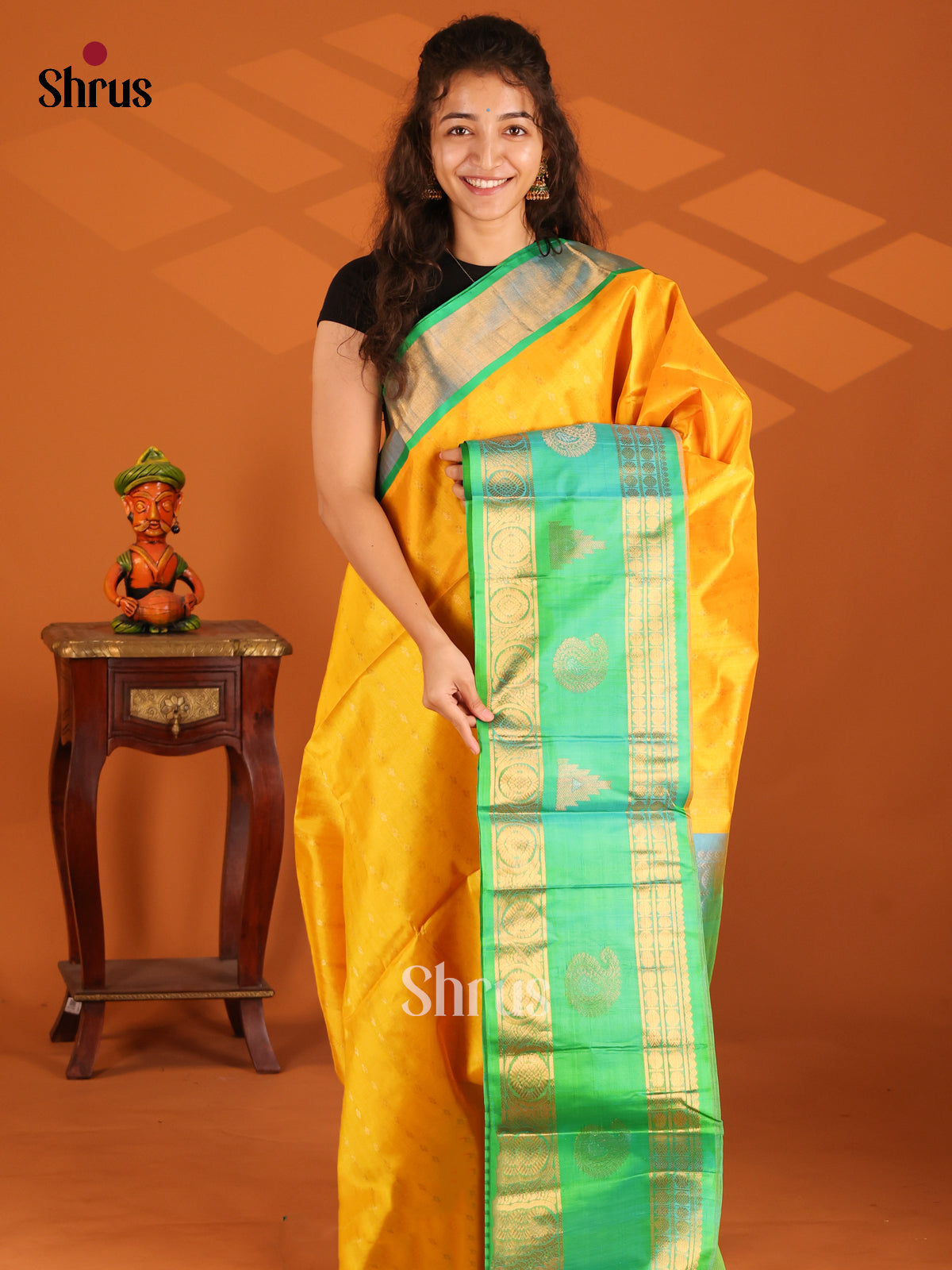 Glorious Yellow Silk Cotton Saree with gold zari buttas & teal green rettaipet zari border