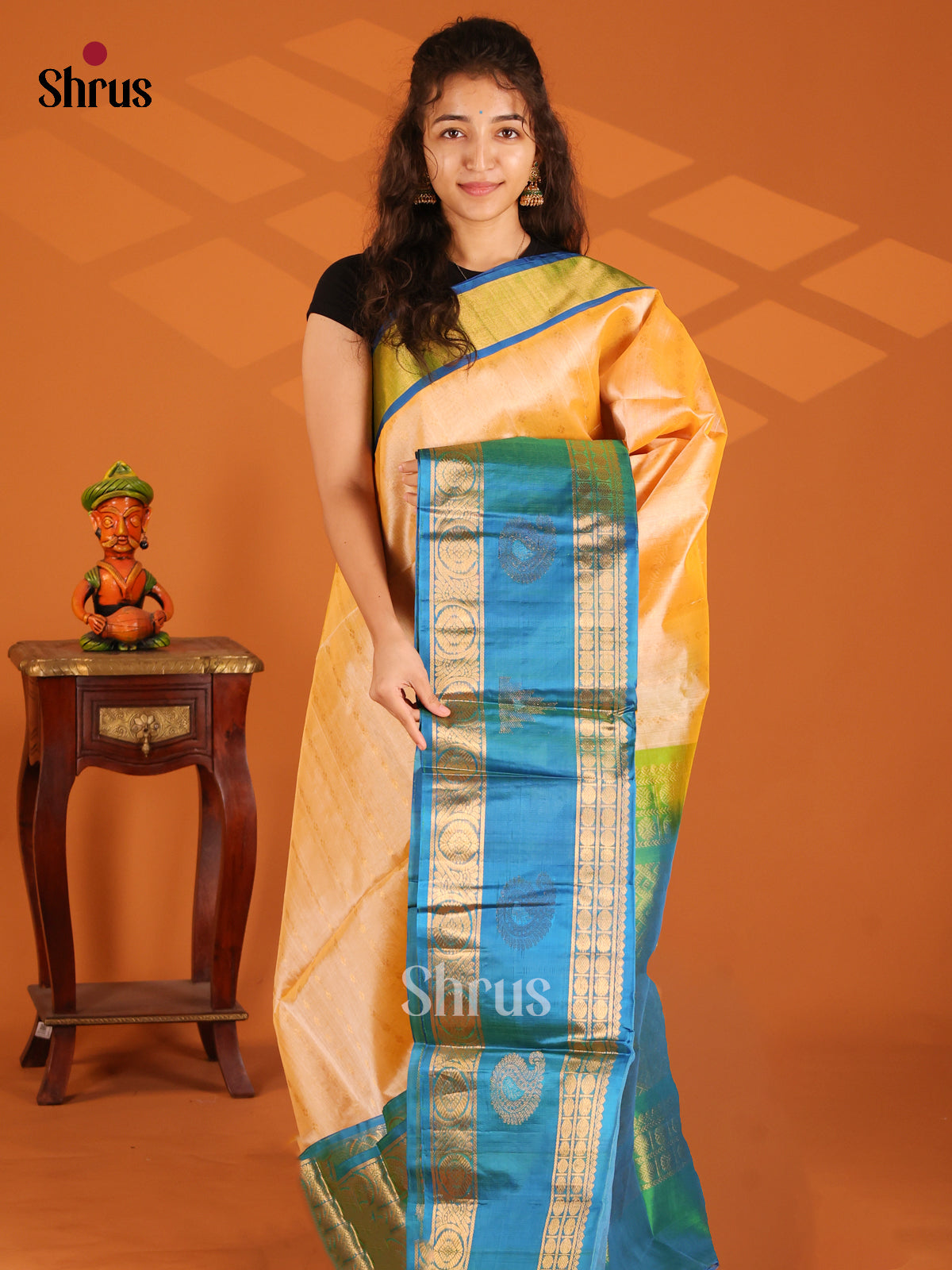 Elegant Peach Silk Cotton Saree gleams with gold zari buttas , blue rettaipet Border