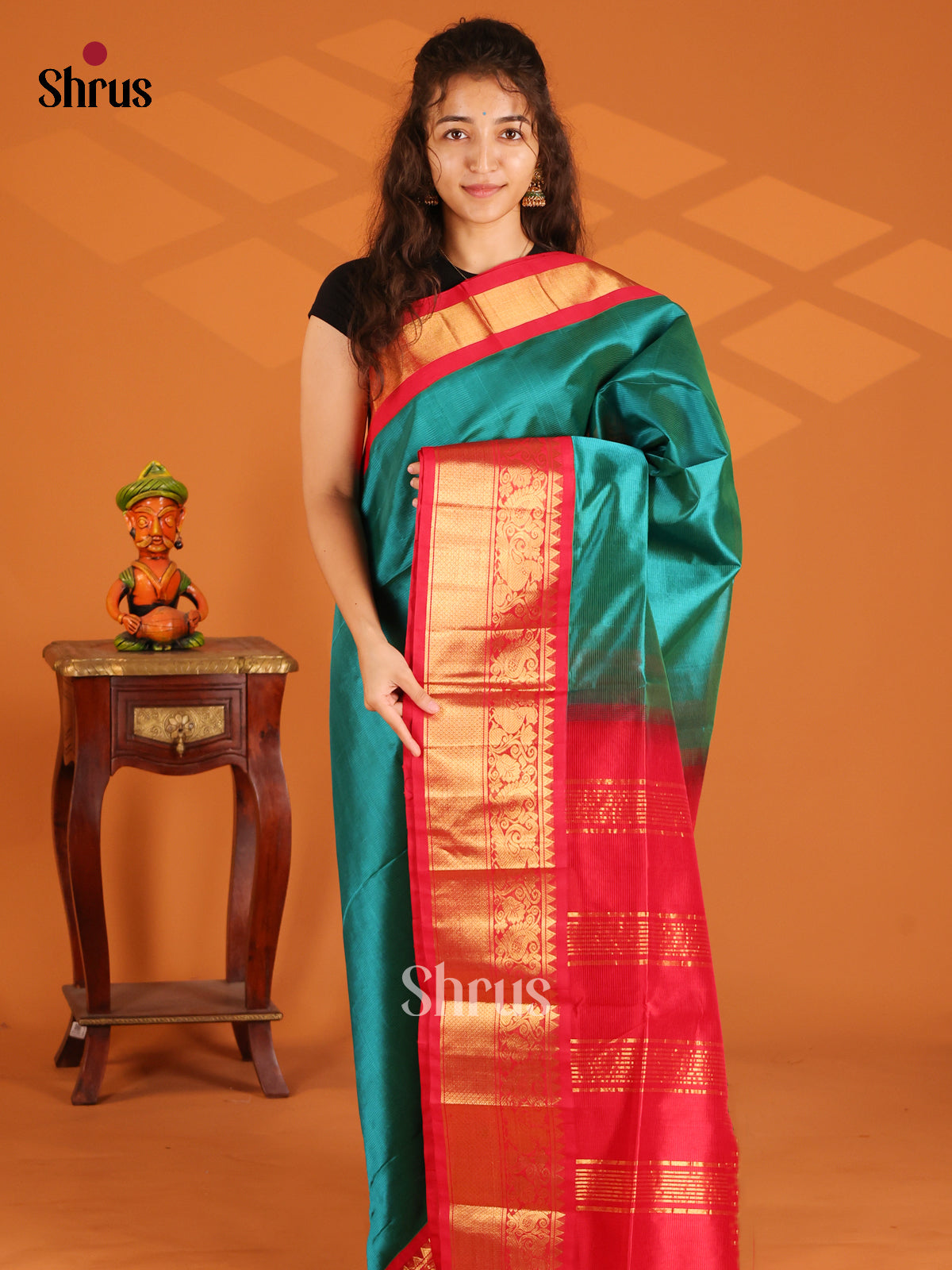 Timeless Peacock Green Silk Cotton Saree with Zari Motifs & Red Border