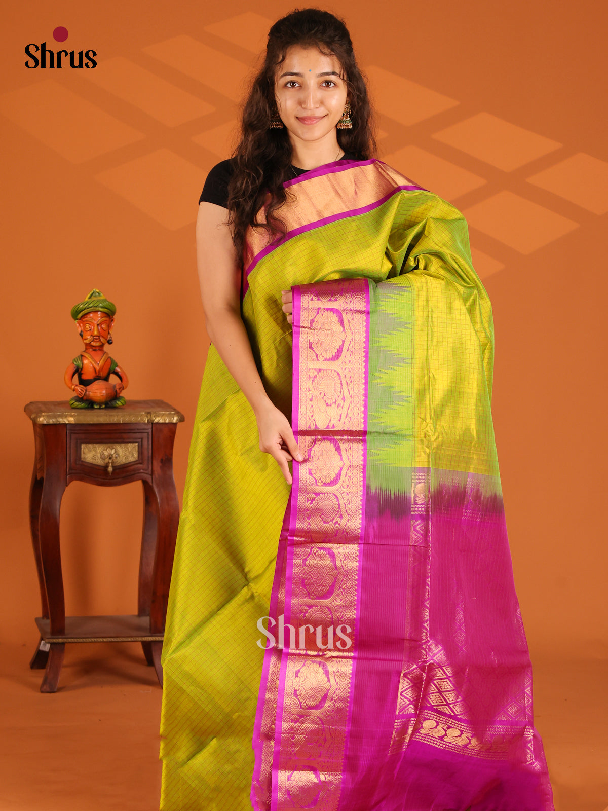Serene Light Green Silk Cotton Saree with Pink Border adorned with peacock & floral motifs - Shop on Shrus.com