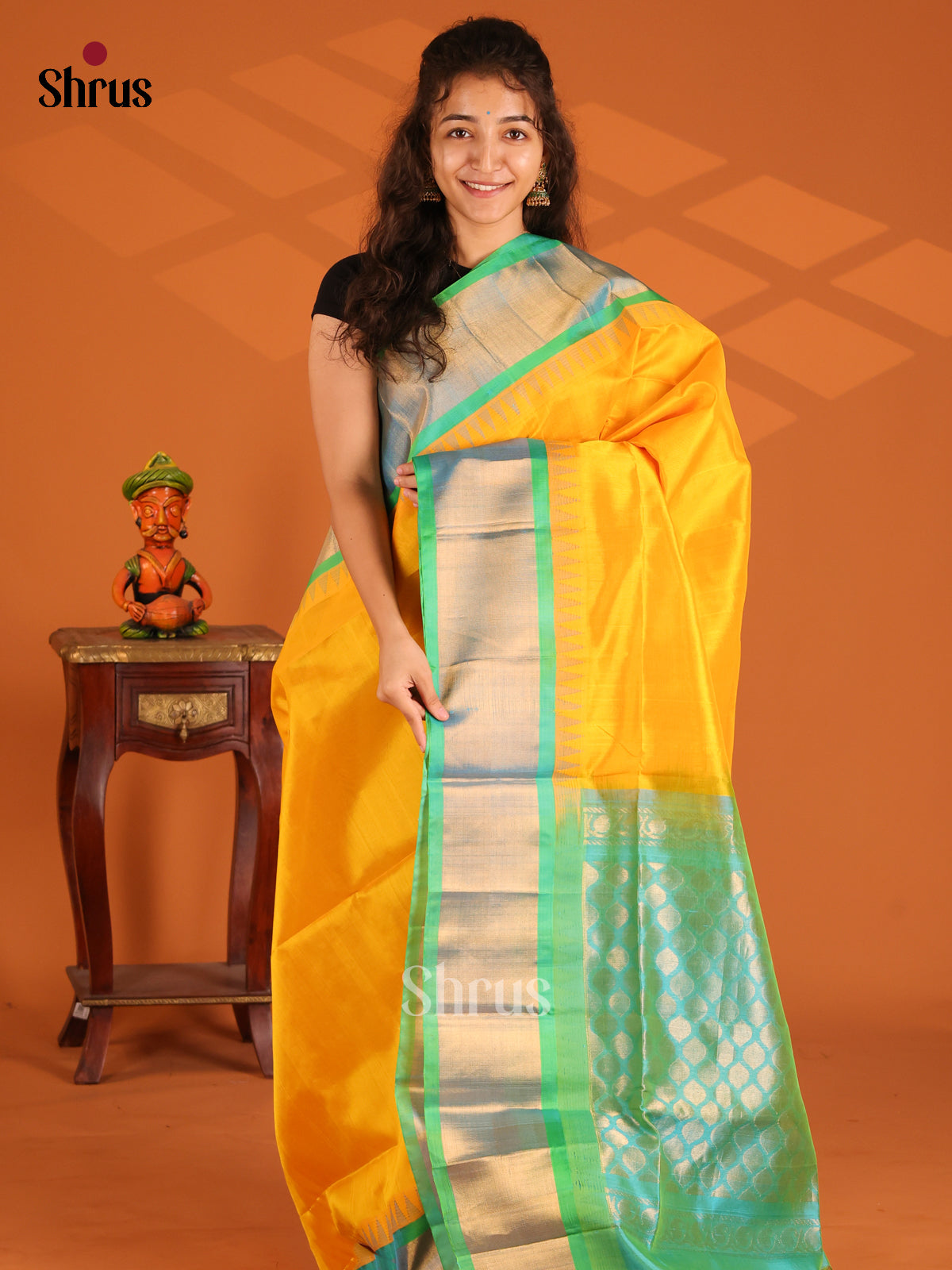 Luminous yellow Silk Cotton Saree with teal green zari brocade pallu - Shop on Shrus.com