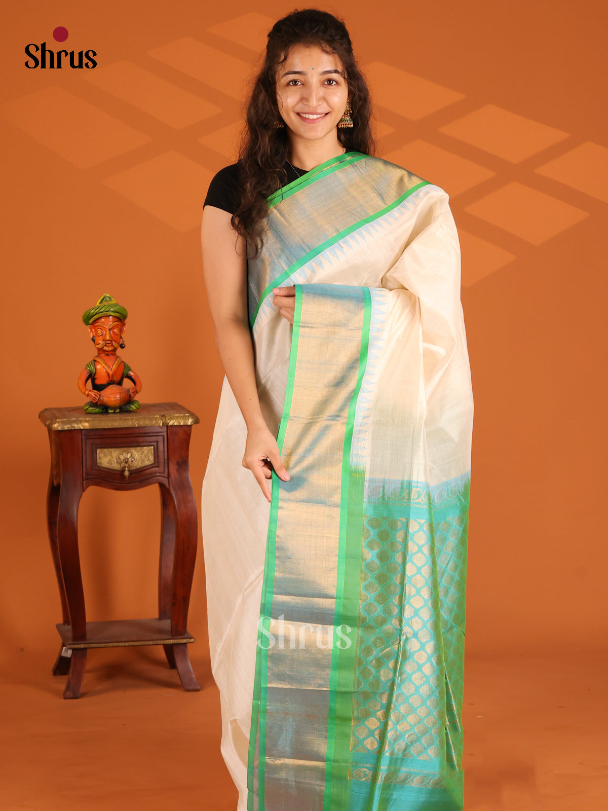 Graceful with teal green kaddi zari Temple border silk cotton saree