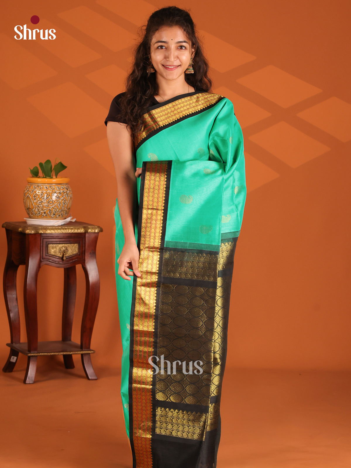 Stunning Sea Green Silk Cotton Saree with Mango Buttas & Black Zari Border