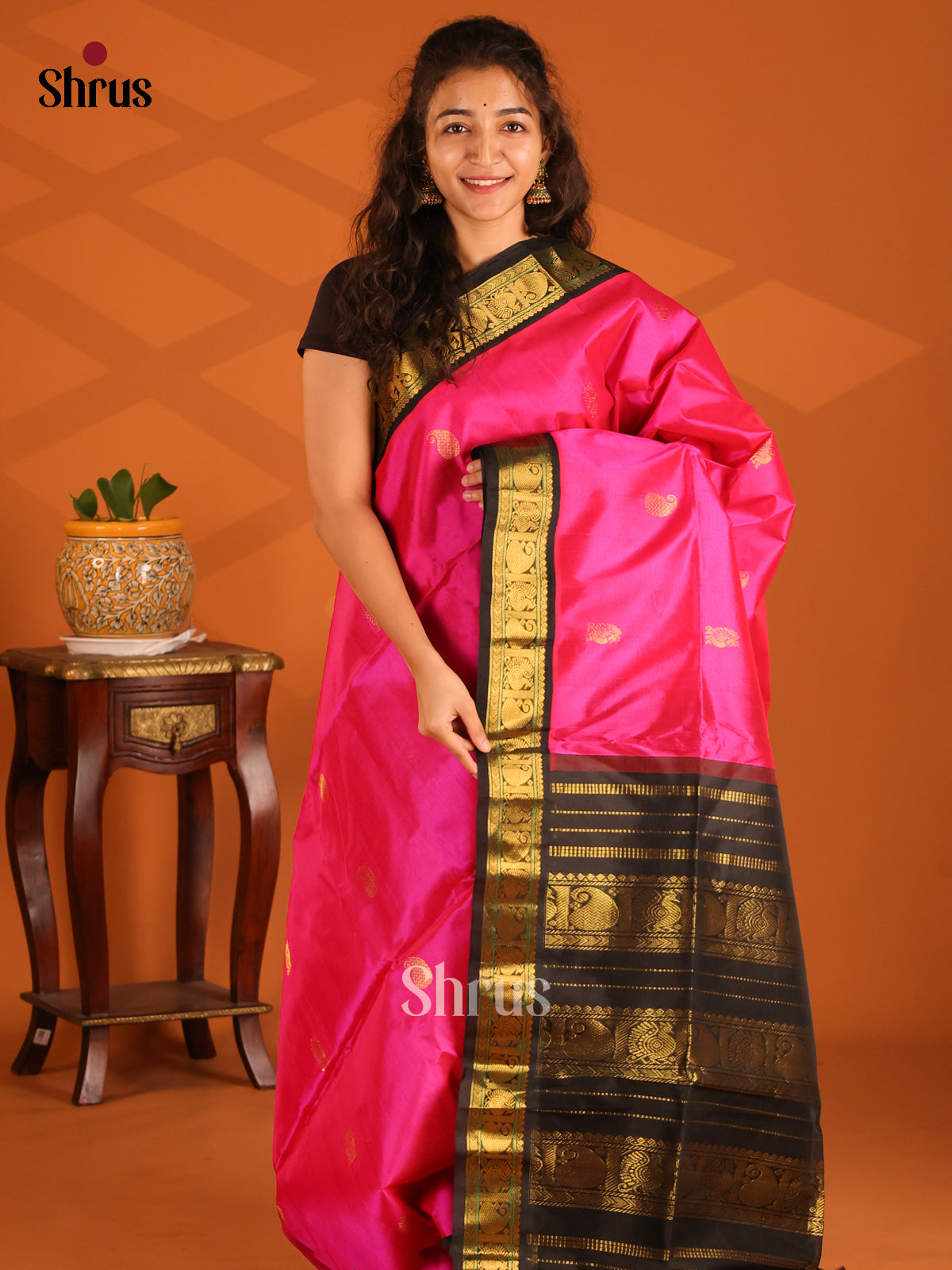 Pink and Brown Silk Cotton Saree gleams with zari peacock, paisleys buttas