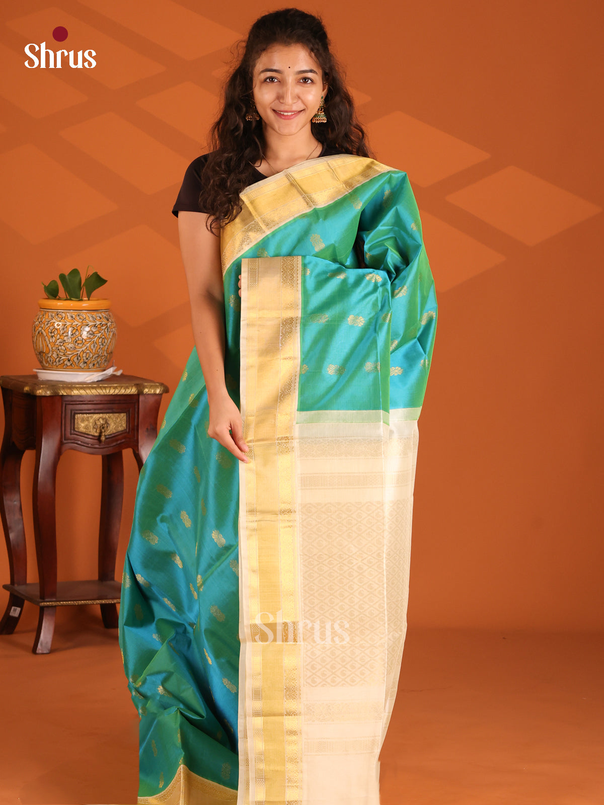 Classy Peacock Blue Silk Cotton Saree with Cream Zari Pallu & Floral Motifs - Shop on Shrus.com