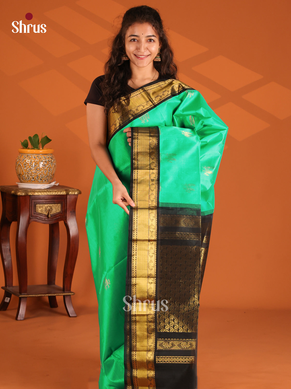 Teal Green with Black Silk Cotton Saree gleams with gold zari peacock buttas - Shop on Shrus.com