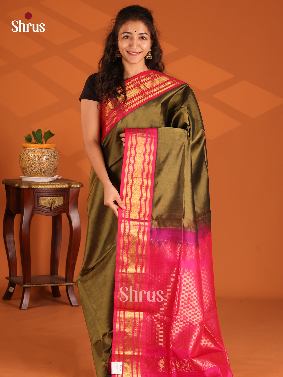Pretty Mehandi Green Silk Cotton Saree with simple body & contrast floral border - Shop on Shrus.com