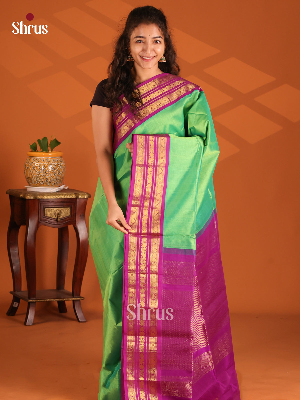 Shimmery Pista Green Silk Cotton Saree with contrast purple zari border - Shop on Shrus.com