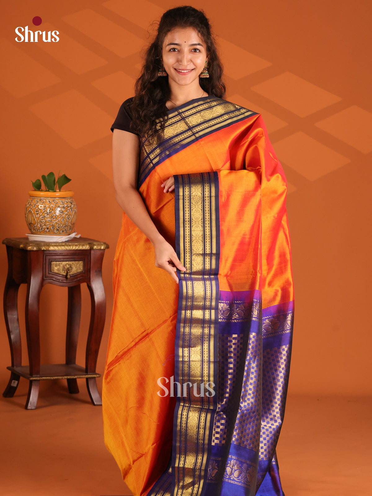 Classy Orange Silk Cotton Saree with Zari woven floral vines in blue border - Shop on Shrus.com