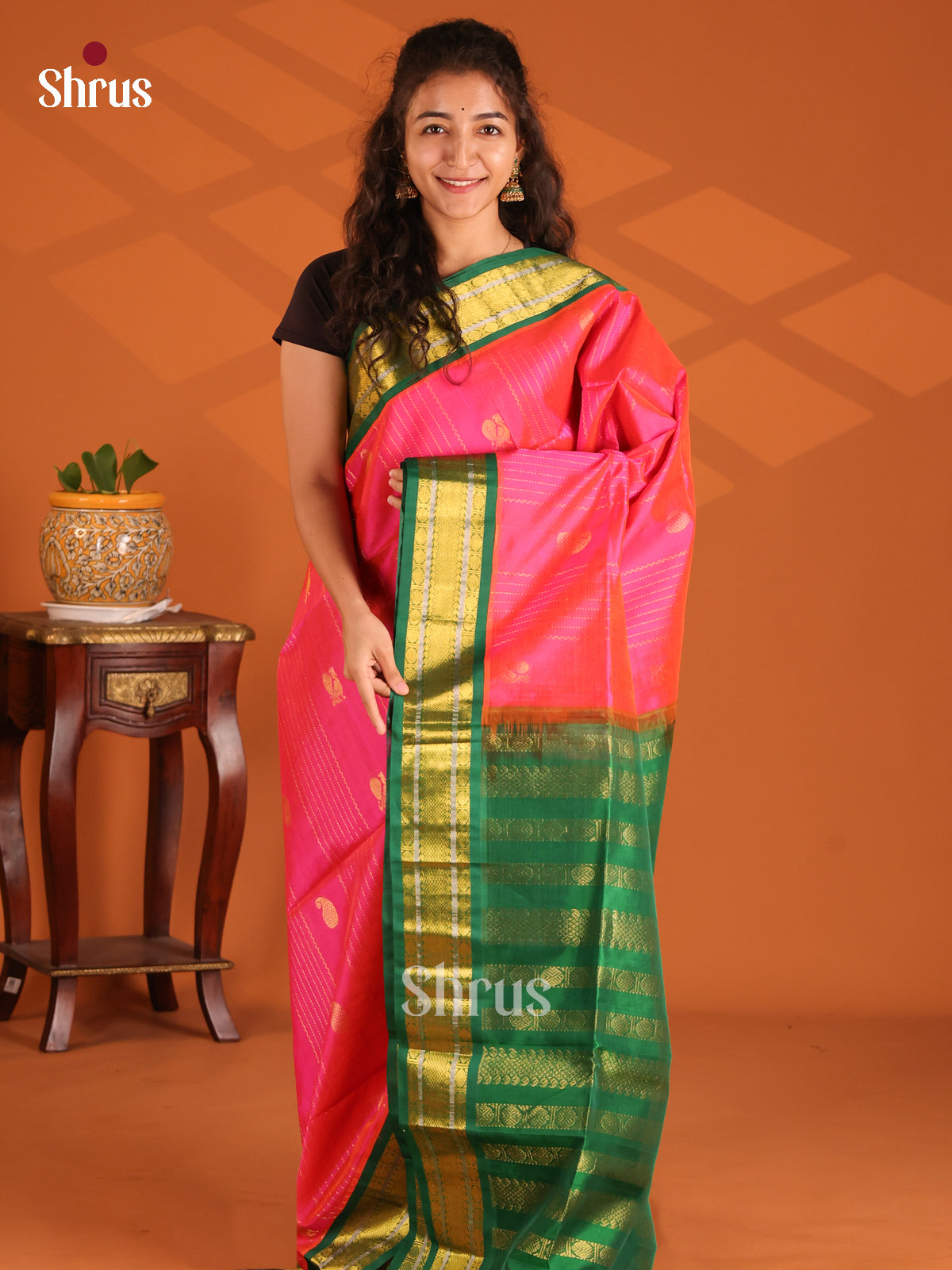 Enchanting Pink Silk Cotton Saree gleams with zari stripes, peacock buttas , green border - Shop on Shrus.com