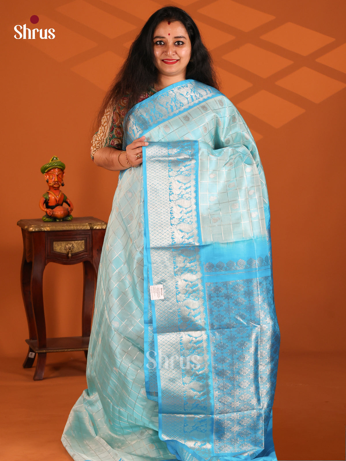 Regal Radiance Ice Blue Venkatagiri Silk with its zari checks, buttis, contrast brocade pallu - Shop on Shrus.com