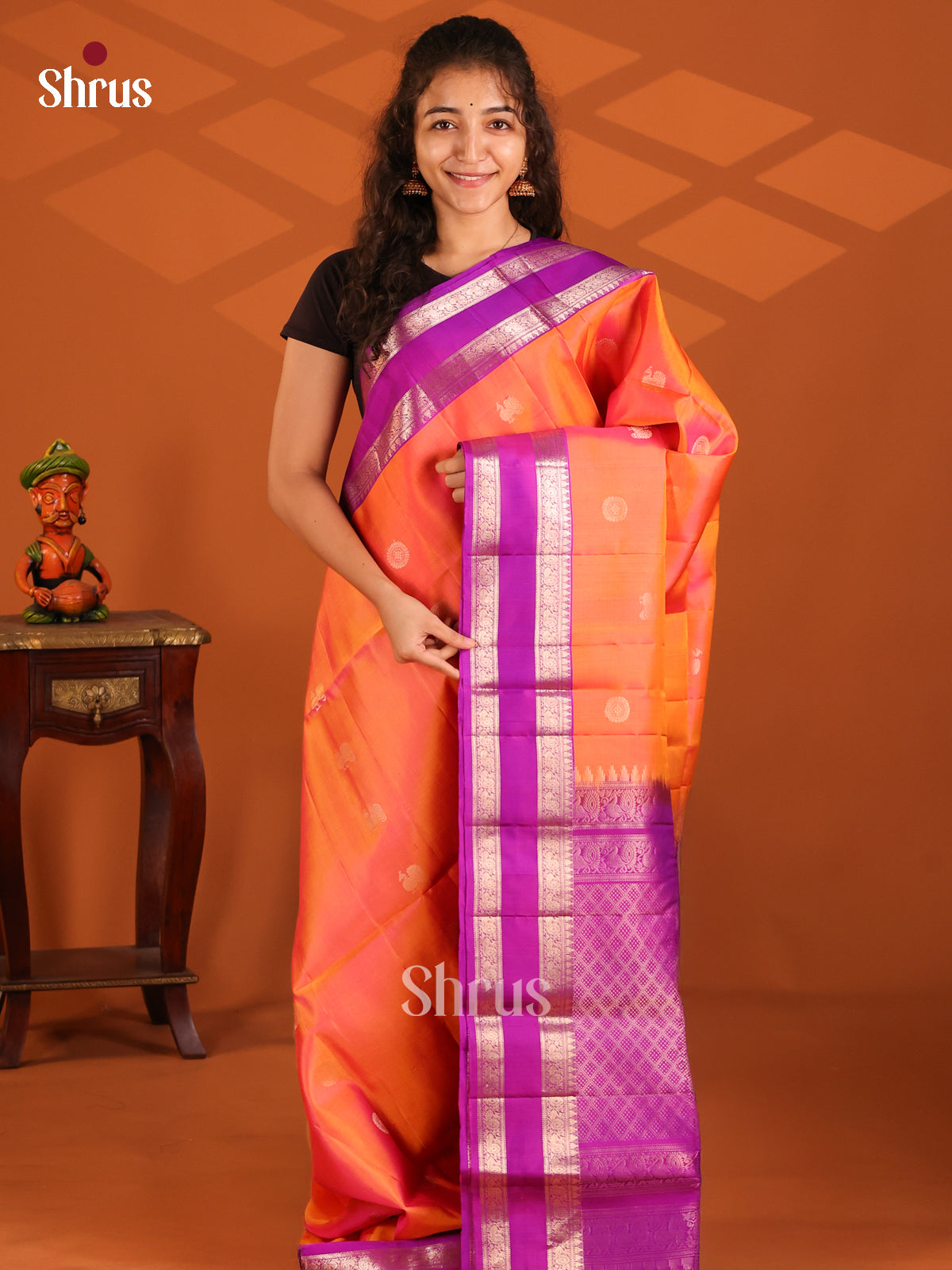 Glimmering Orange Soft Silk Saree with zari chakra, peacock butta & Purple Rettaipet border - Shop on Shrus.com