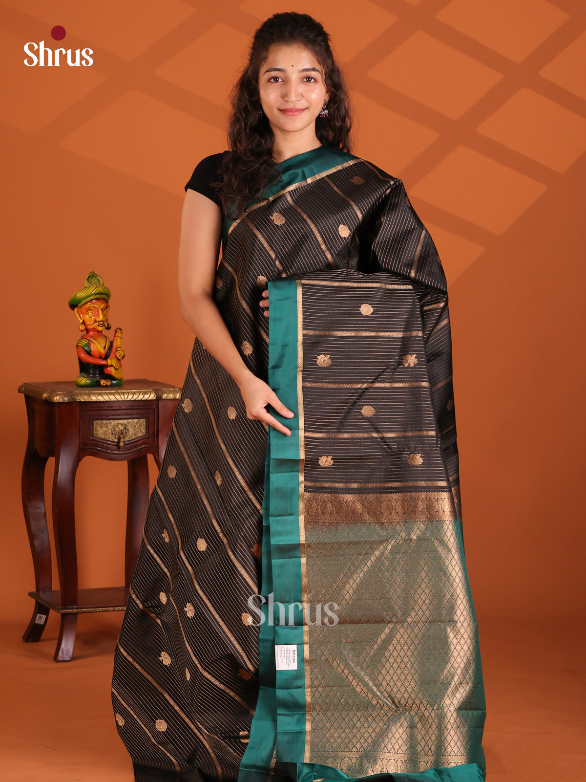 Beautiful Black Kanchipuram silk (HR) Saree with peacock green border