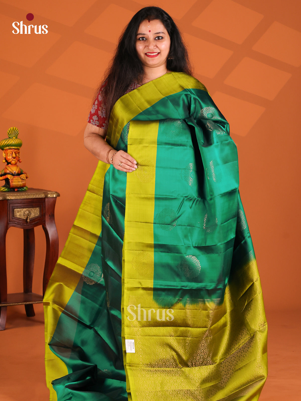 Classy Green Softsilk-halfpure Saree gleams with gold zari floral motifs
