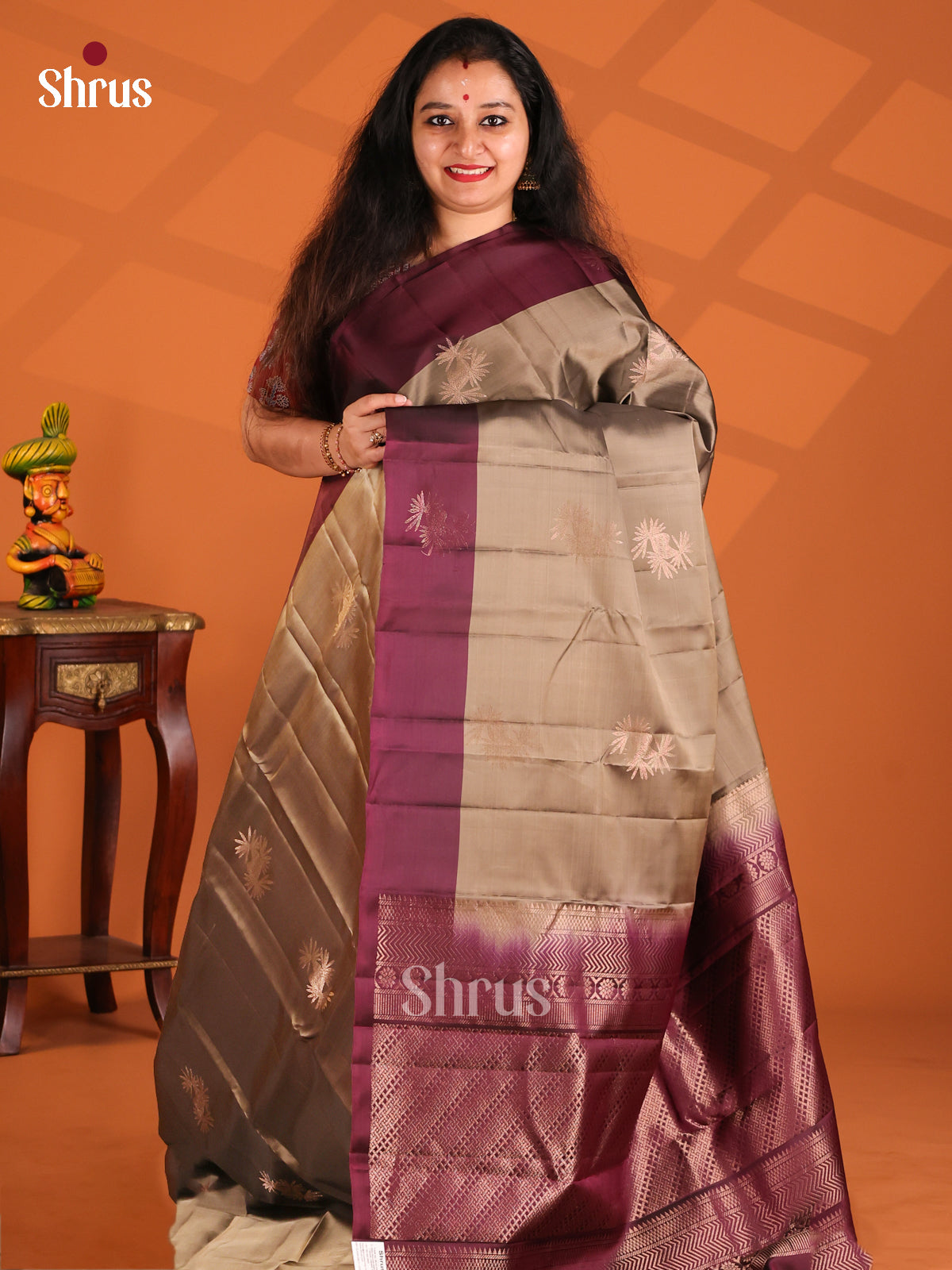 Charming Grey Softsilk-halfpure Saree gleams with gold zari floral buttas
