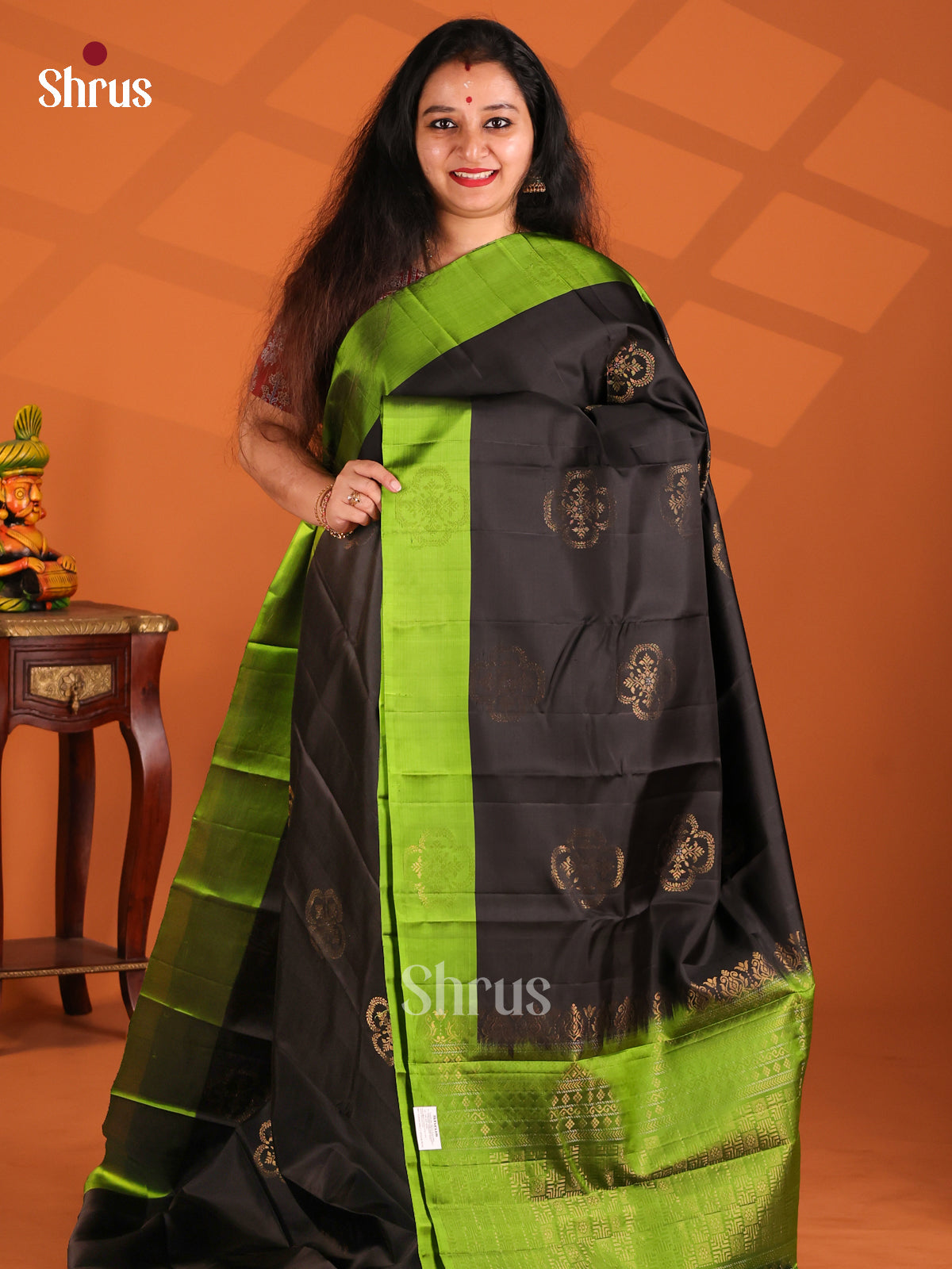 Lustrous Black Softsilk-halfpure Saree with green brocade pallu