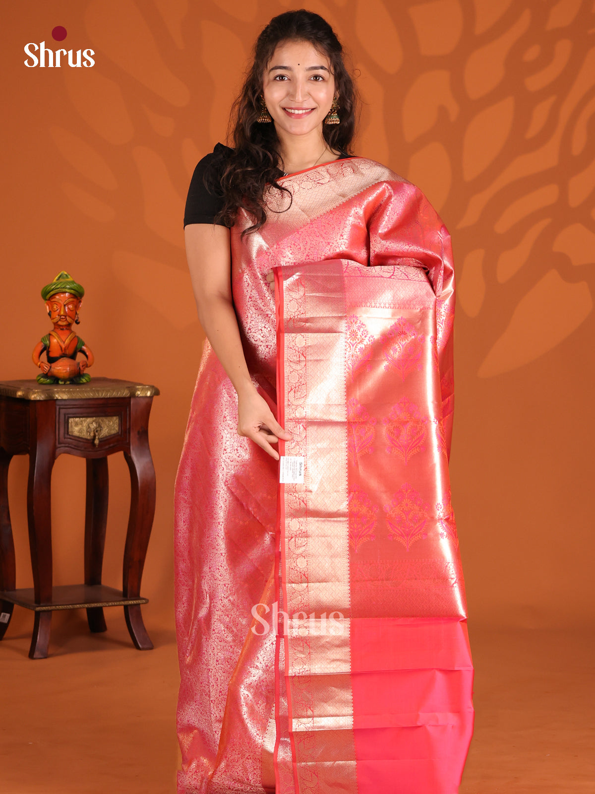 Orangish pink Kanchipuram silk Saree dazzles with floral nestling brocade-1