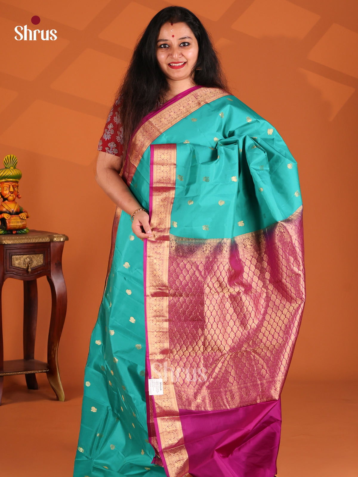 Chic Teal Kanchipuram silk Saree with majenta peacock buttas brocade border-1