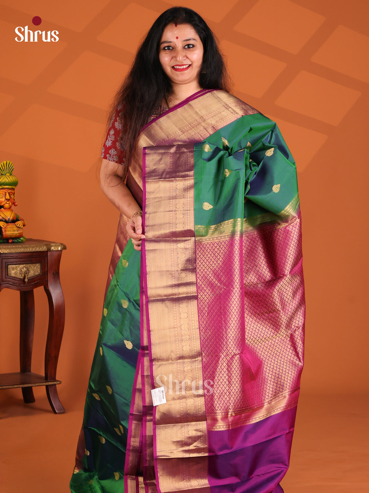 Classy Green Kanchipuram silk Saree with traditional purple zari border