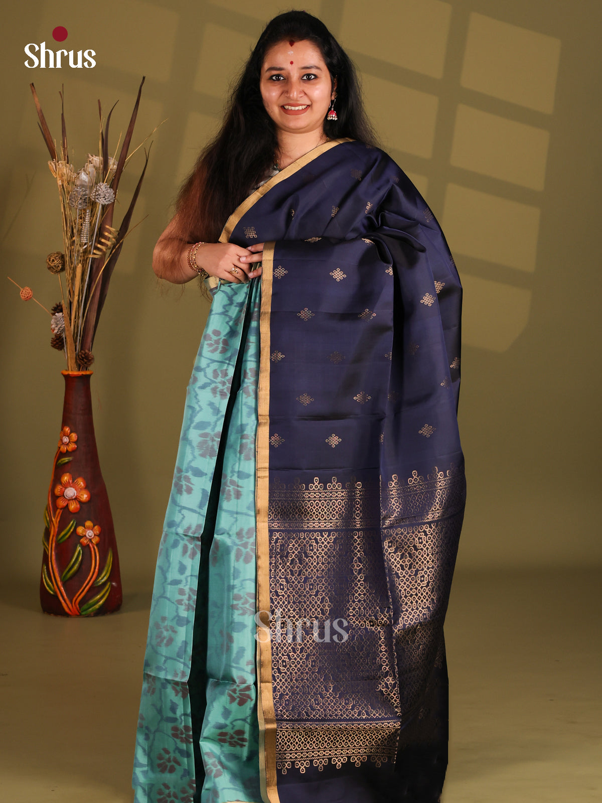Teal & Blue Soft Silk Saree with ikkat floral woven kolam zari buttas