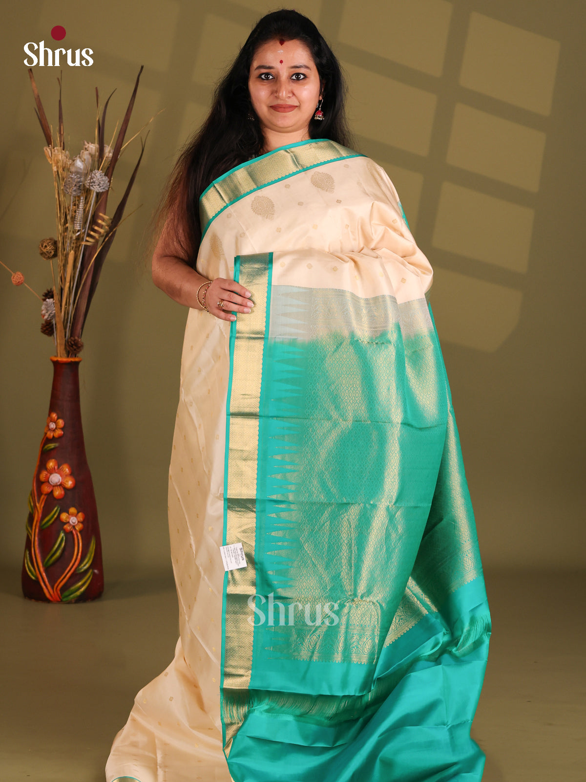 Cream and Teal Kanchipuram silk (HR) Saree gleams with zari floral buttas - Shop on Shrus.com