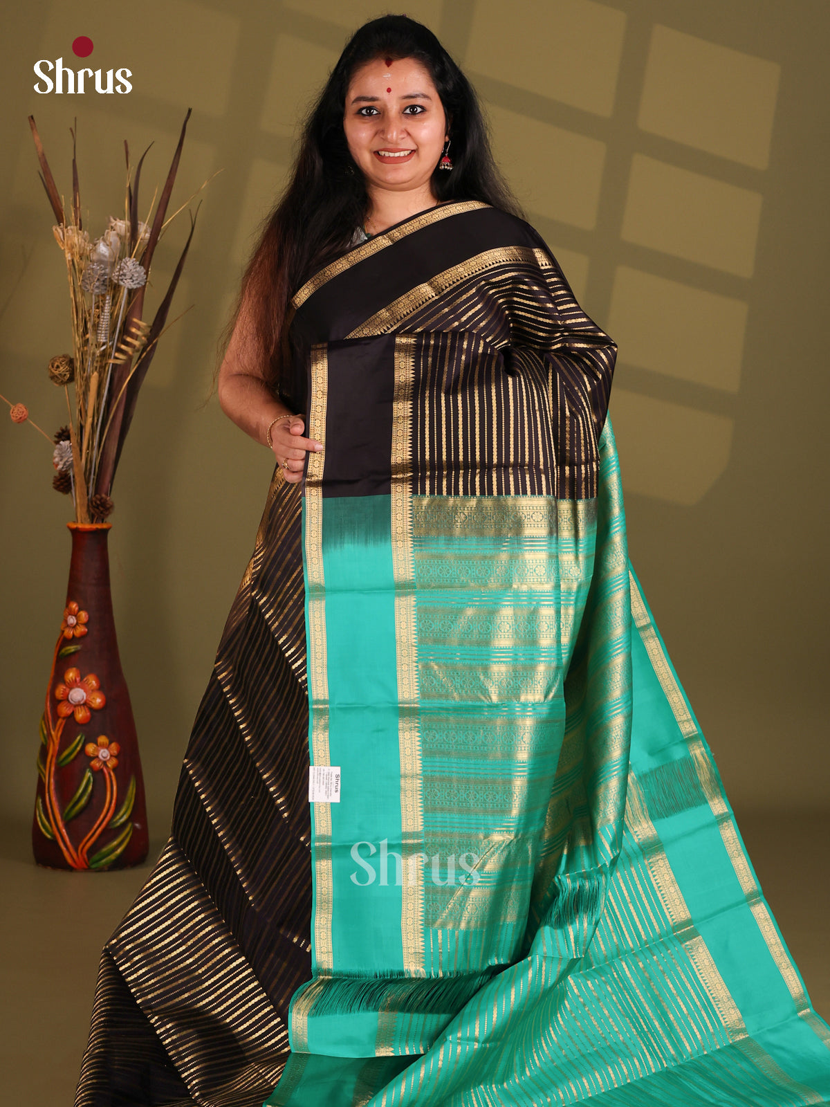 Black and green Kanchipuram silk (HR) Saree with zari stripes