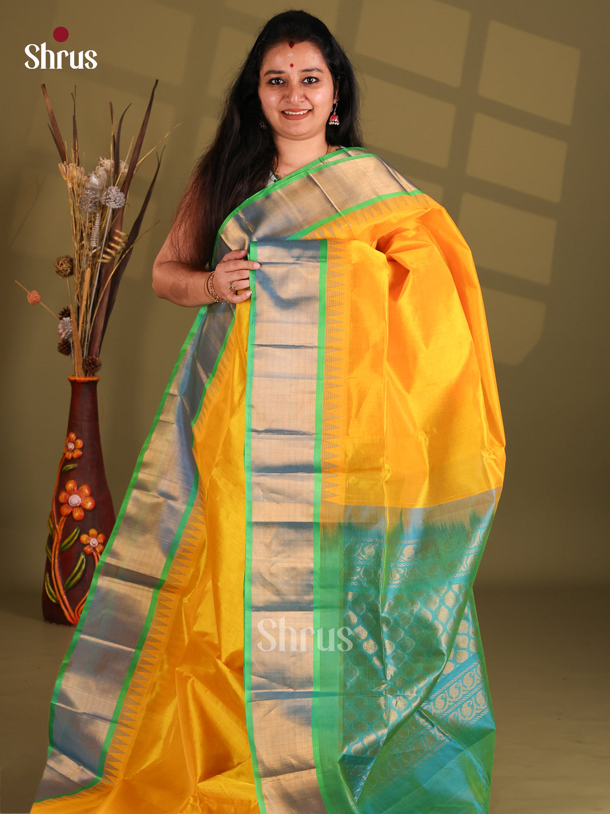 Luminous Yellow Silk Cotton Saree with teal kaddi zari boder - Shop on Shrus.com