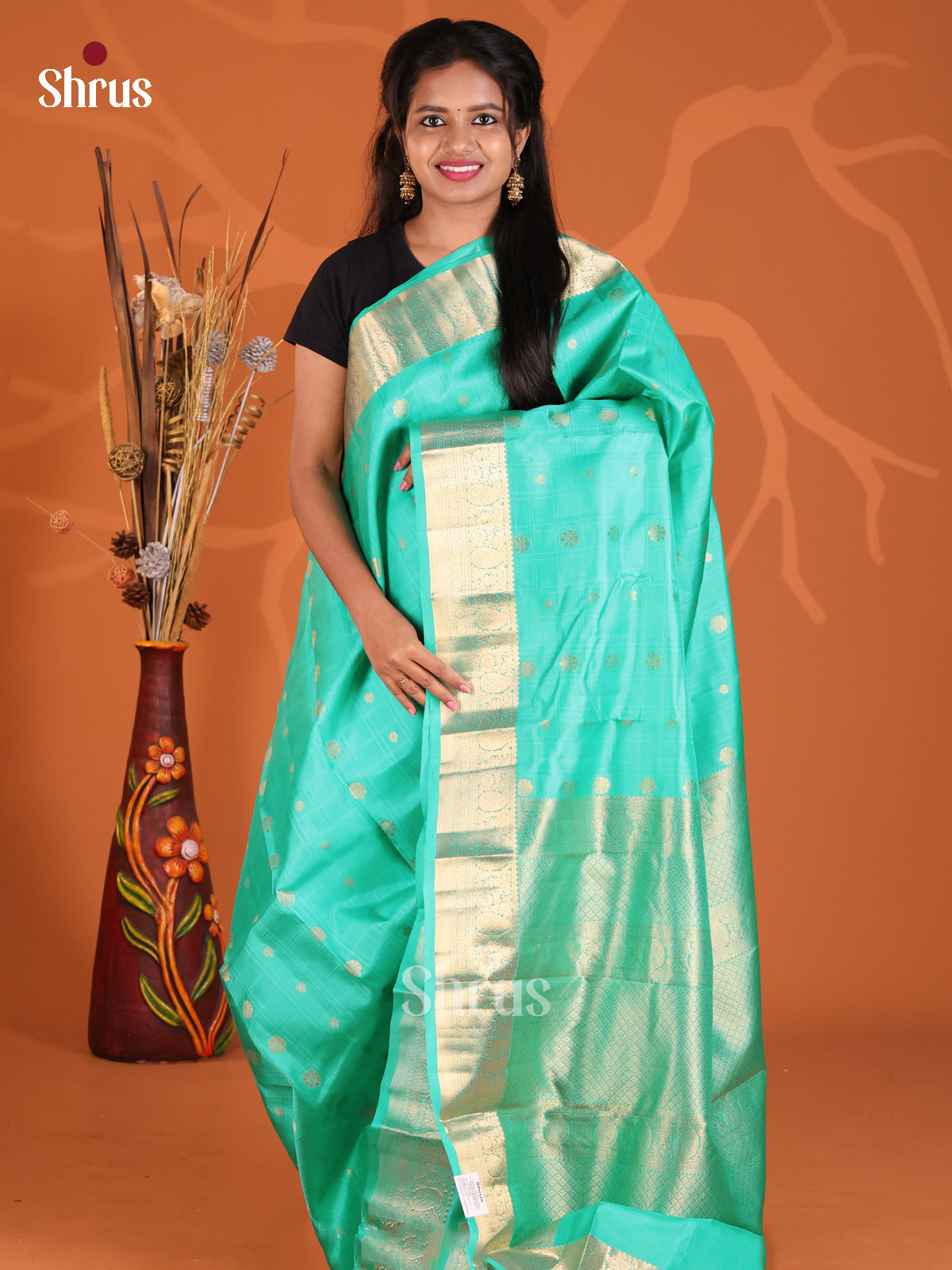Teal single Tone kanchipuram silk saree with gold zari floral buttas - Shop on Shrus.com
