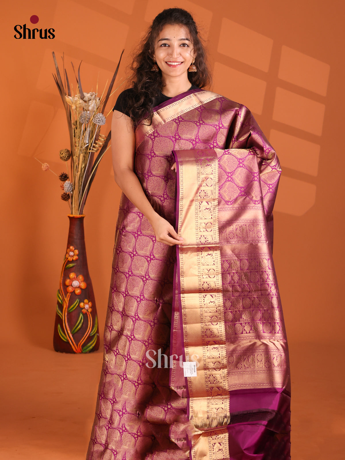 Charming Purple Kanchipuram silk Saree gleams with zari floral brocade