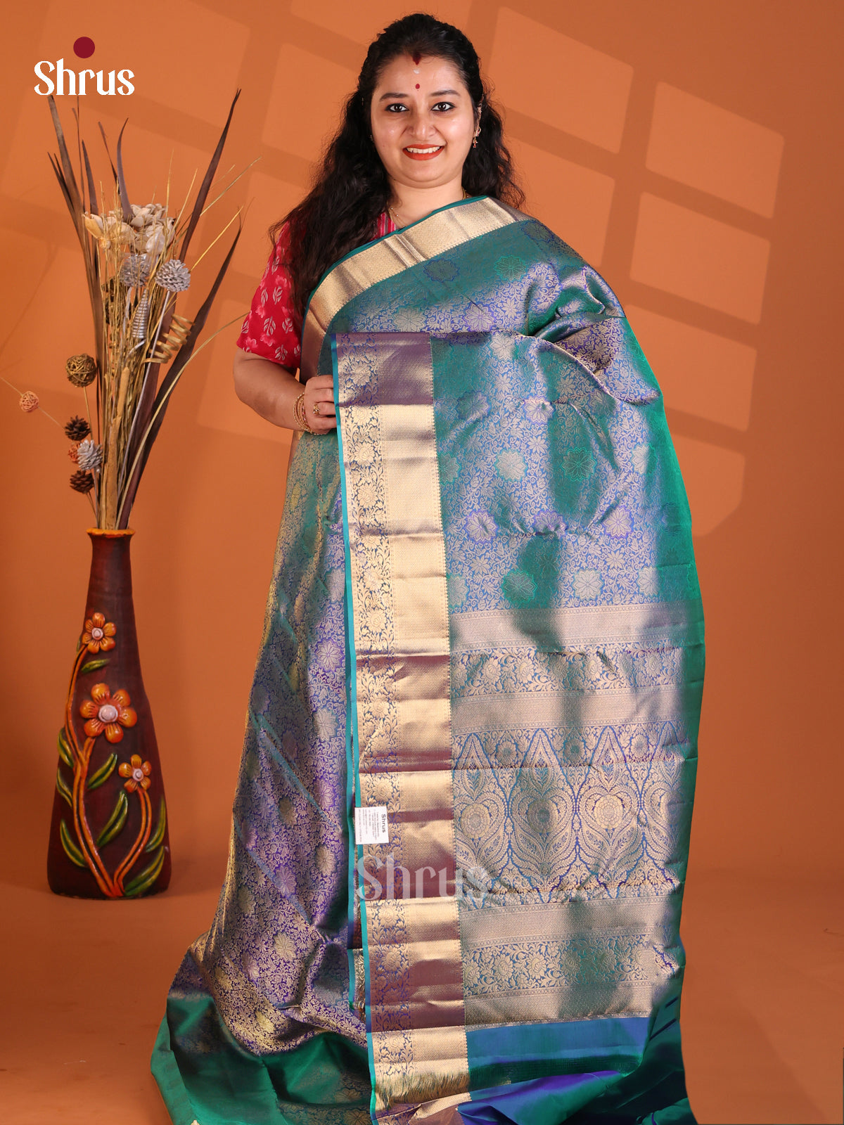 Dazzling Blue Kanchipuram silk Saree with gold zari floral nestling brocade
