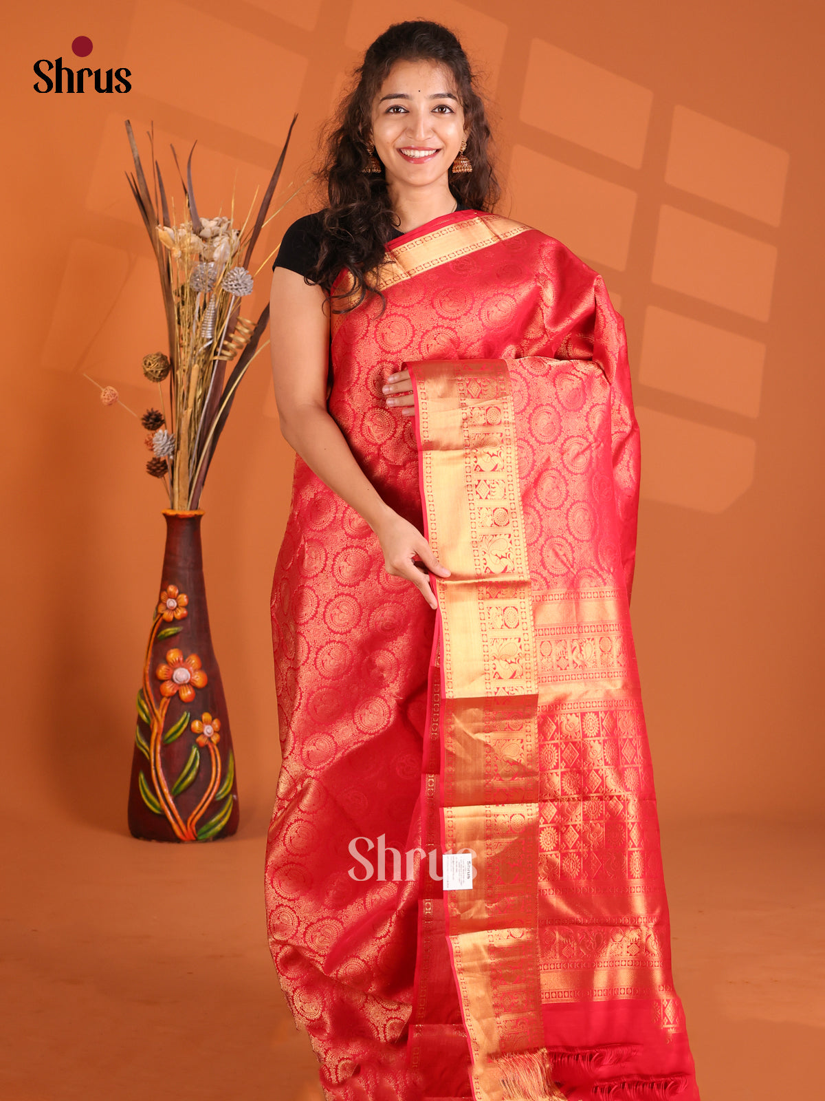 Classy Red Kanchipuram silk Saree gleams with gold zari peacock motifs brocade