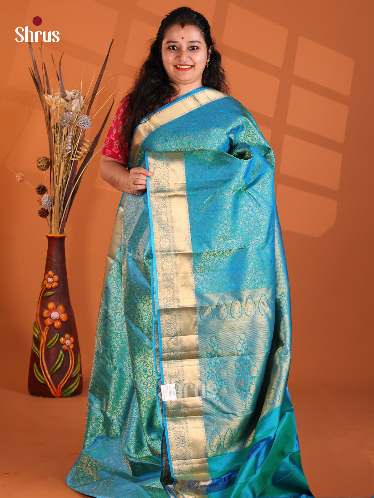 Elegant Peacock blue Kanchipuram silk Saree dazzles with floral nestling brocade-1