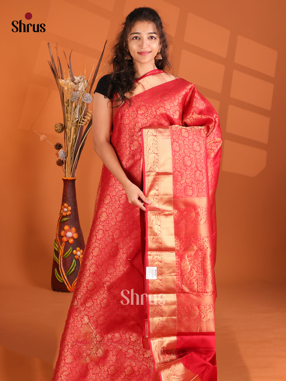 Gorgeous Red Kanchipuram silk Saree with zari peacock buttas in floral brocade