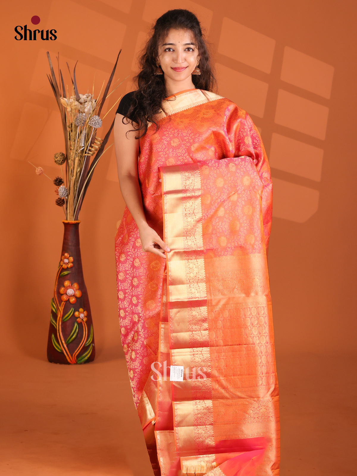 Glimmering Orange monochrome Kanchipuram silk Saree with floral nestling brocade-1