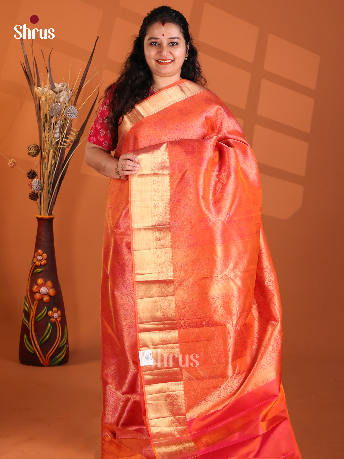 Radiant Orange Kanchipuram silk Saree with gold zari floral nestling brocade