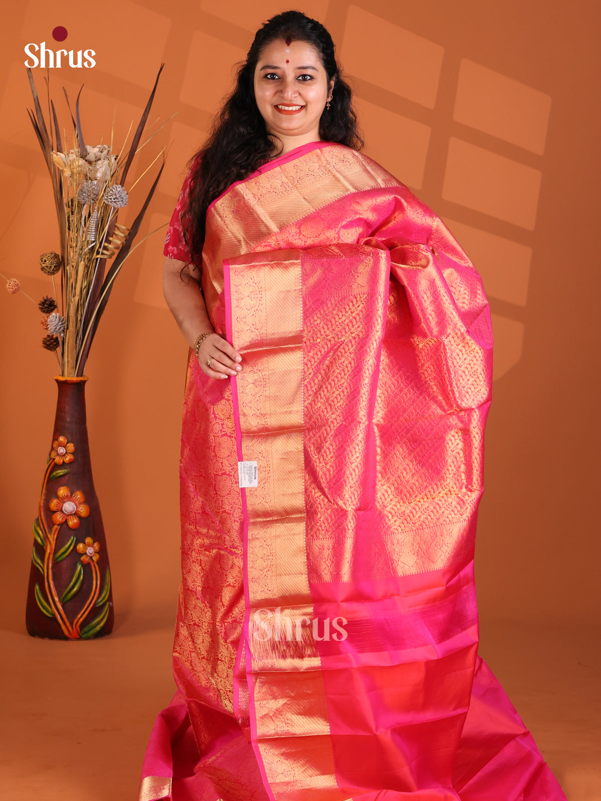 Stunning Pink single tone Kanchipuram silk Saree with gold zari floral brocade