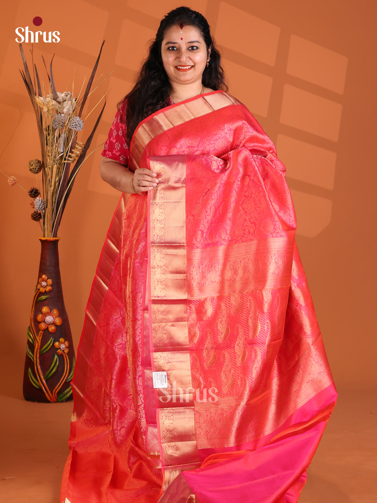 Lustrous Orangish Pink Single Tone Kanchipuram silk Saree with zari floral nestling-1