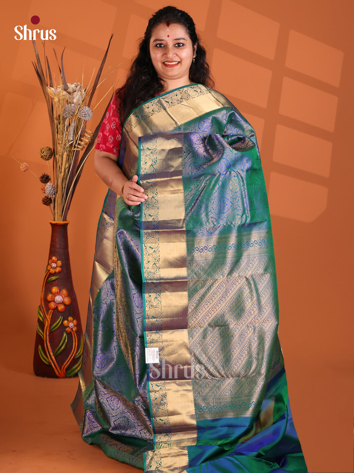 Beautiful Peacock Blue Kanchipuram silk Saree with zari floral nestling brocade