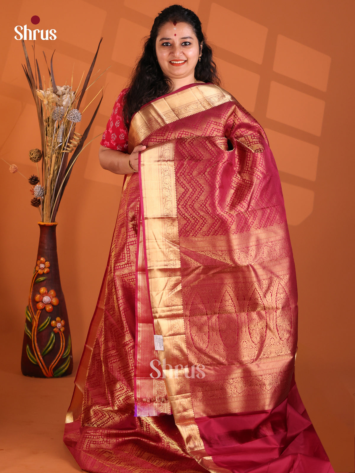 Maroon single tone Kanchipuram silk Saree with gold zari chevron brocade
