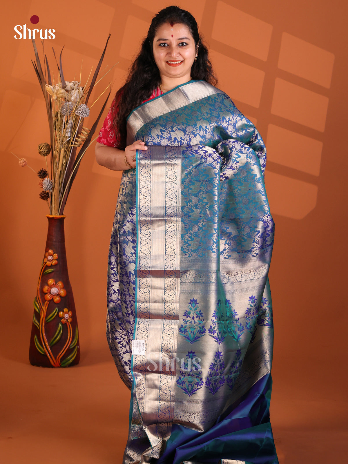 Royal Blue single Tone Kanchipuram silk Saree with elephant buttas in floral brocade