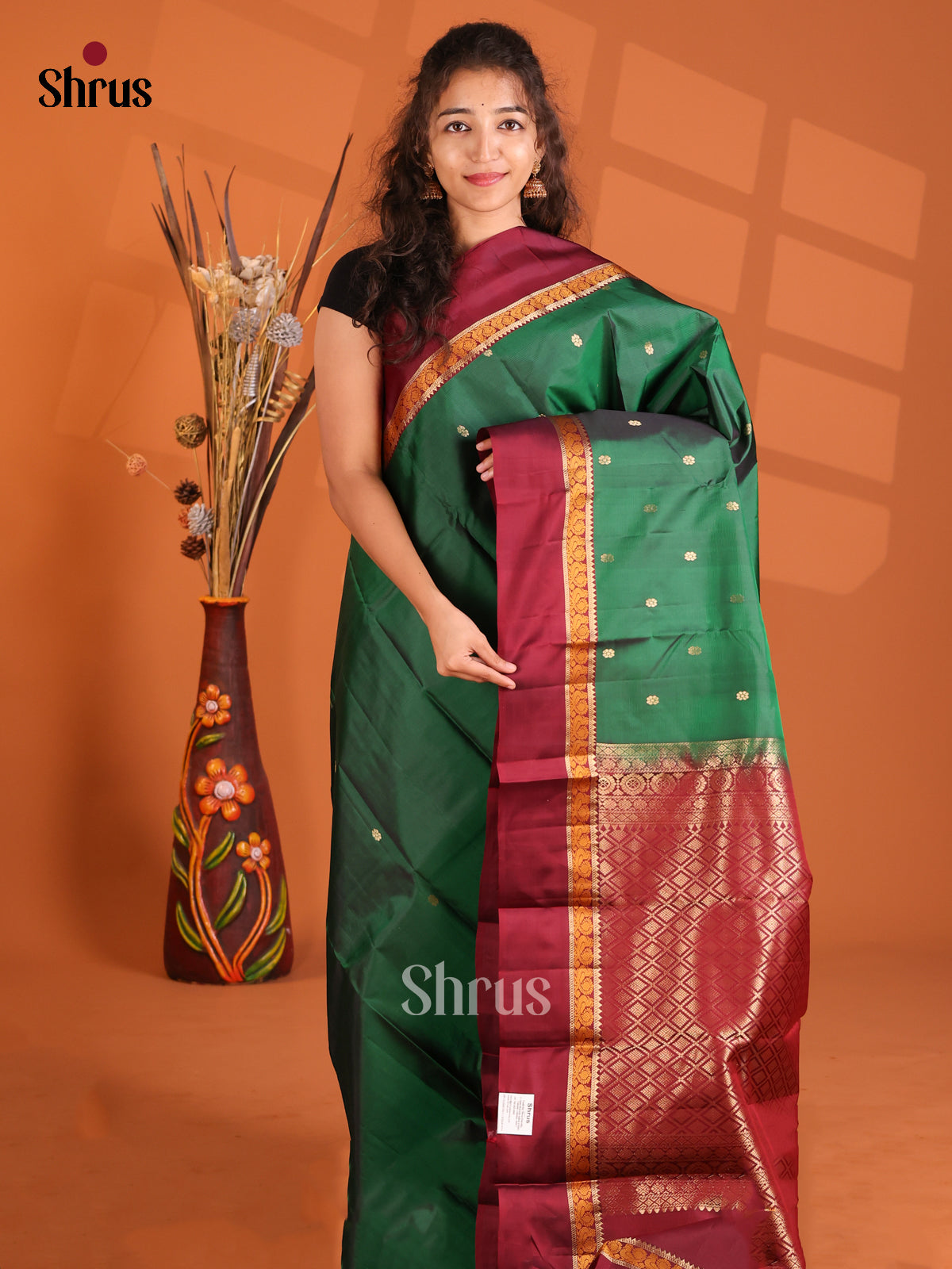 Classy Green & Maroon Kanchipuram silk Saree gleams with dotted buttas