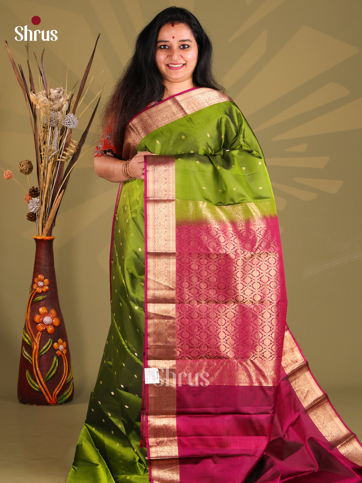 Serene Green Kanchipuram silk Saree with contrast Maroon zari border