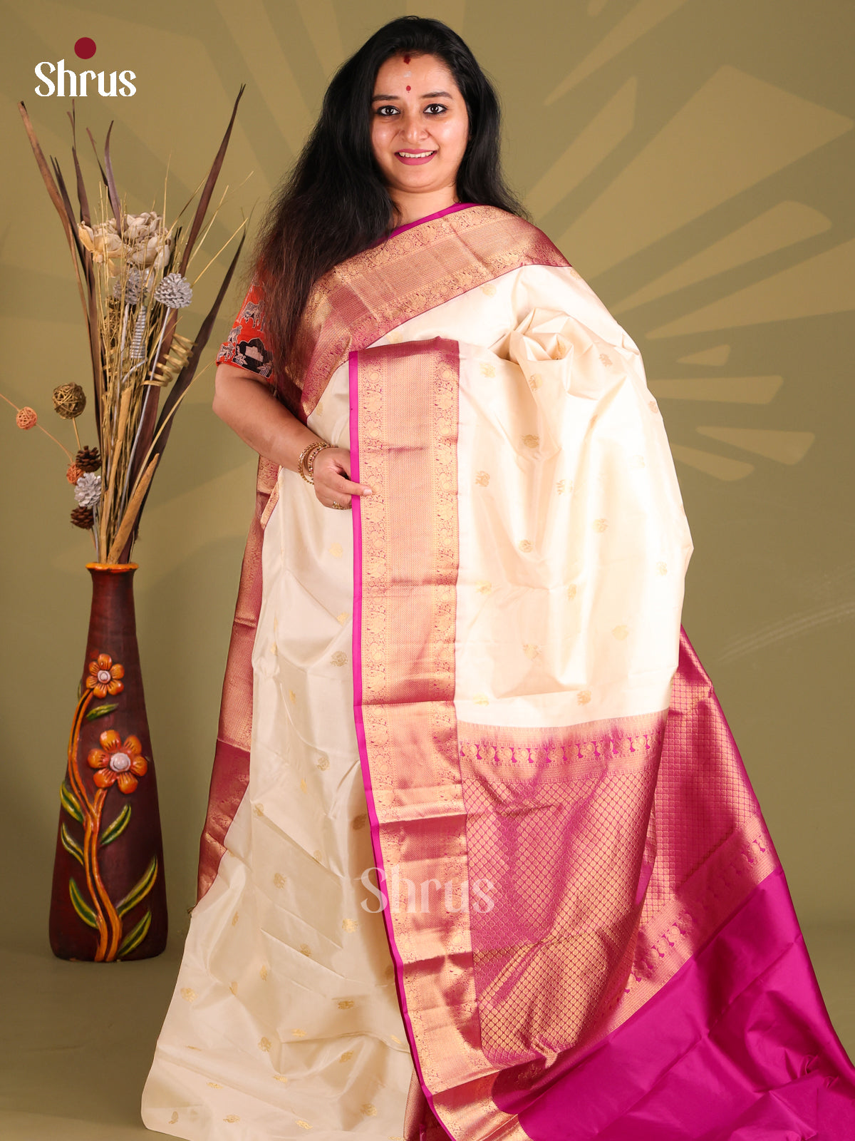 Charming Cream Kanchipuram silk Saree with zari peacock buttas , rich border