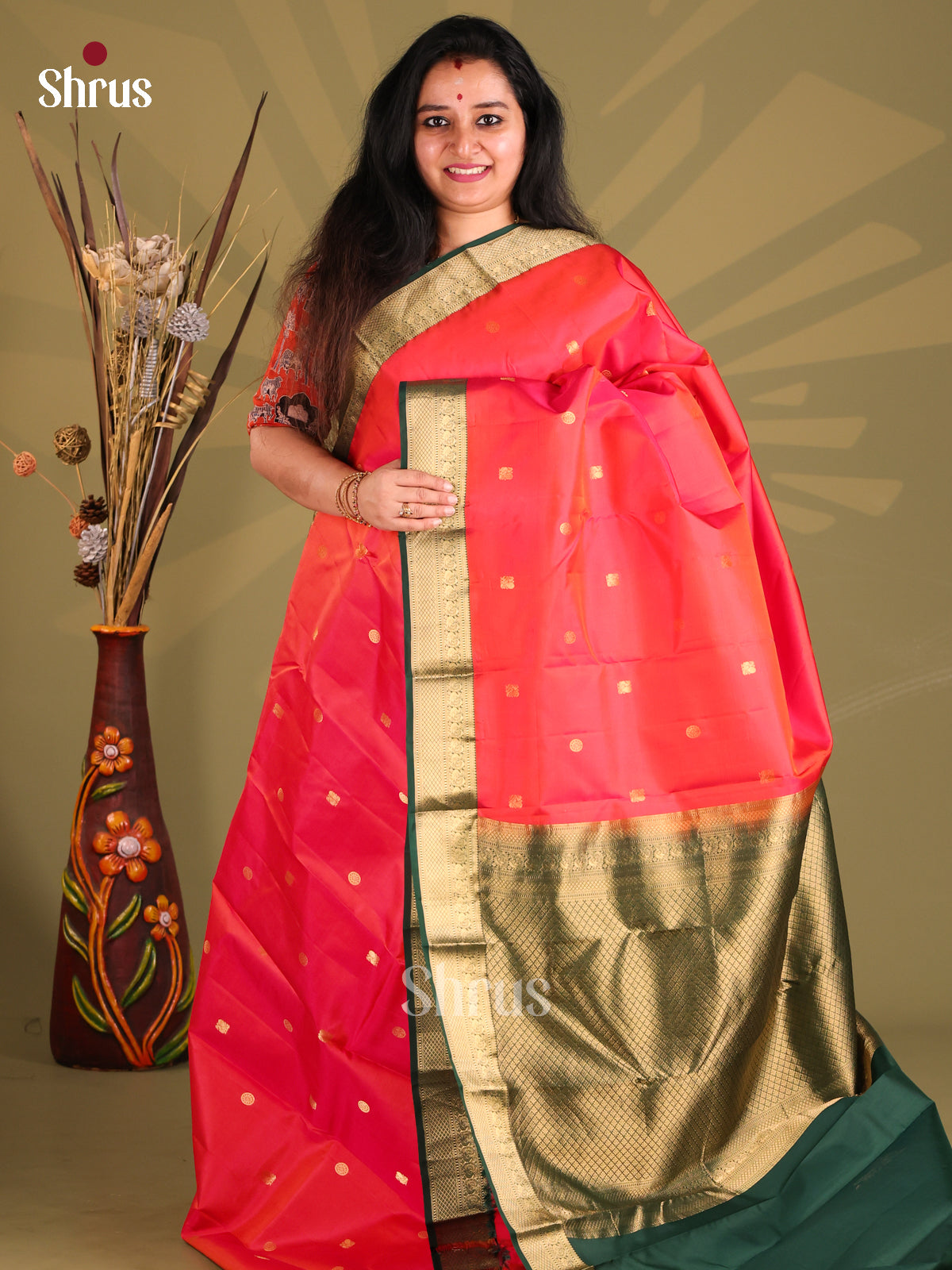 Orangish Pink & Green Kanchipuram silk Saree sizzles with gold zari peacock buttas-1