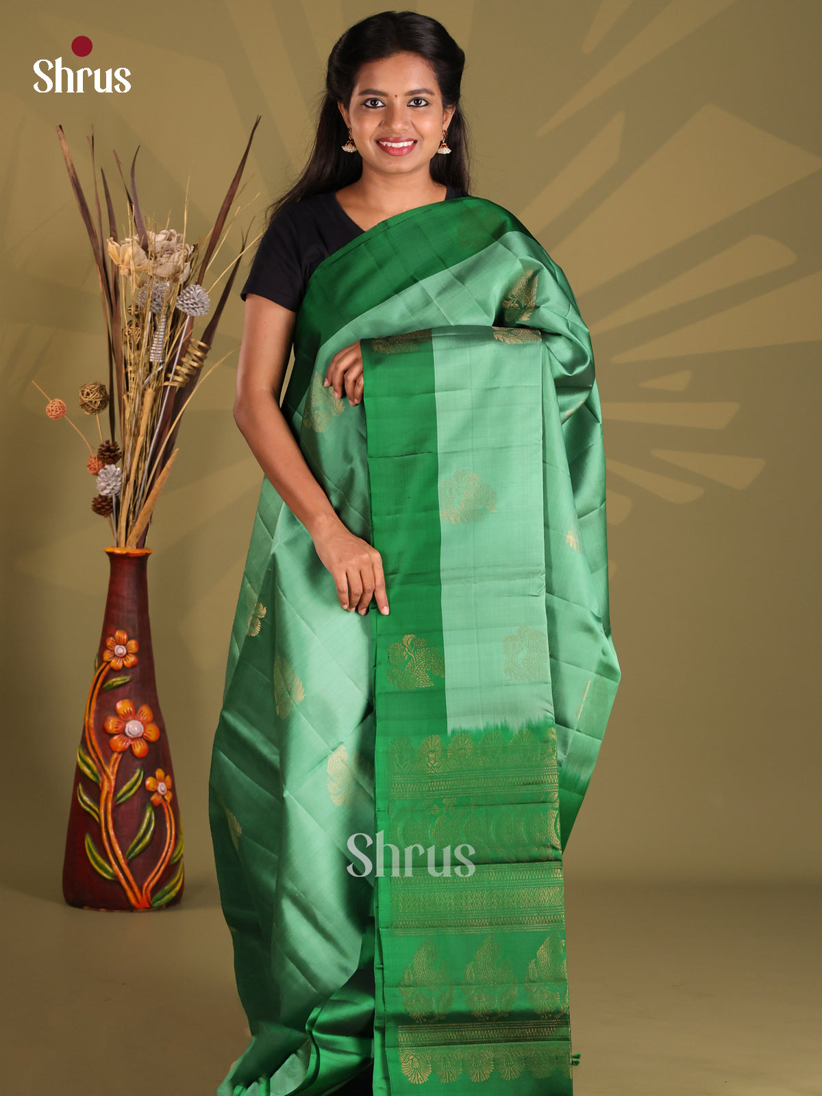 Pastel Green Soft silk-halfpure Saree with zari floral motifs