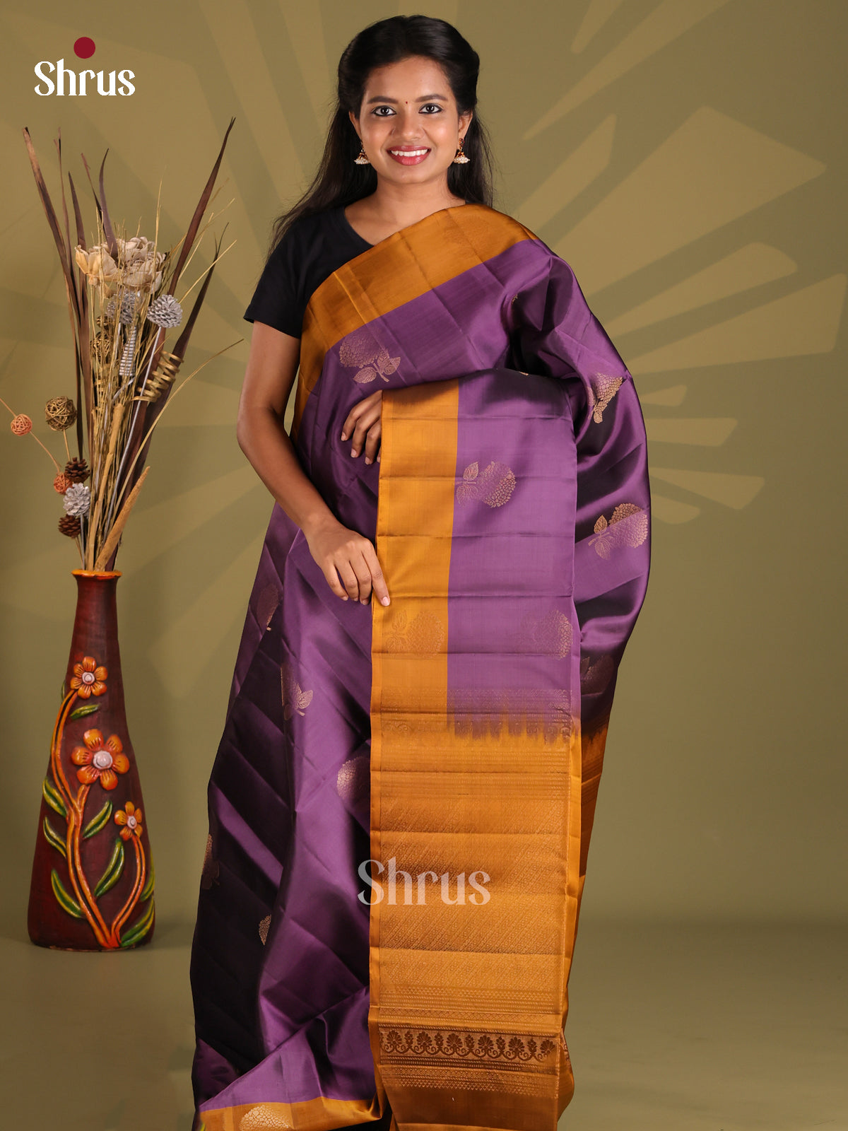 Gorgeous Violet Softsilk-halfpure Saree gleams with zari floral buttas