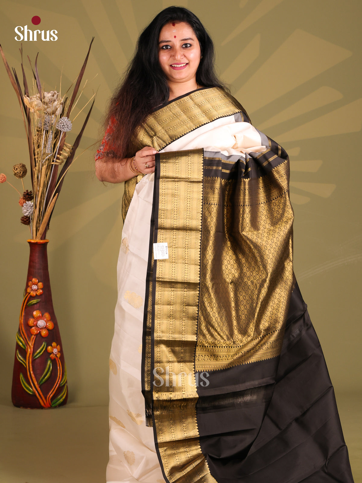 Gorgeous White & Black Kanchipuram silk Saree with rich gold zari border