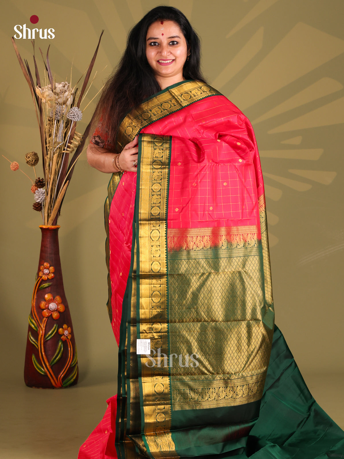Radiant Pink & Green Kanchipuram silk Saree with rich traditional zari border